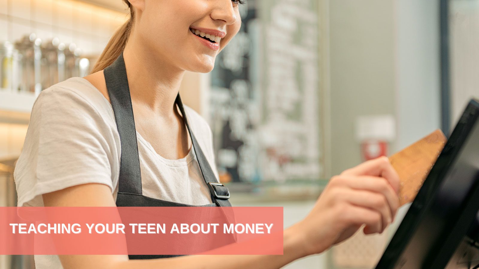 Teaching Your Teen About Money, picture of young adult in front of computer
